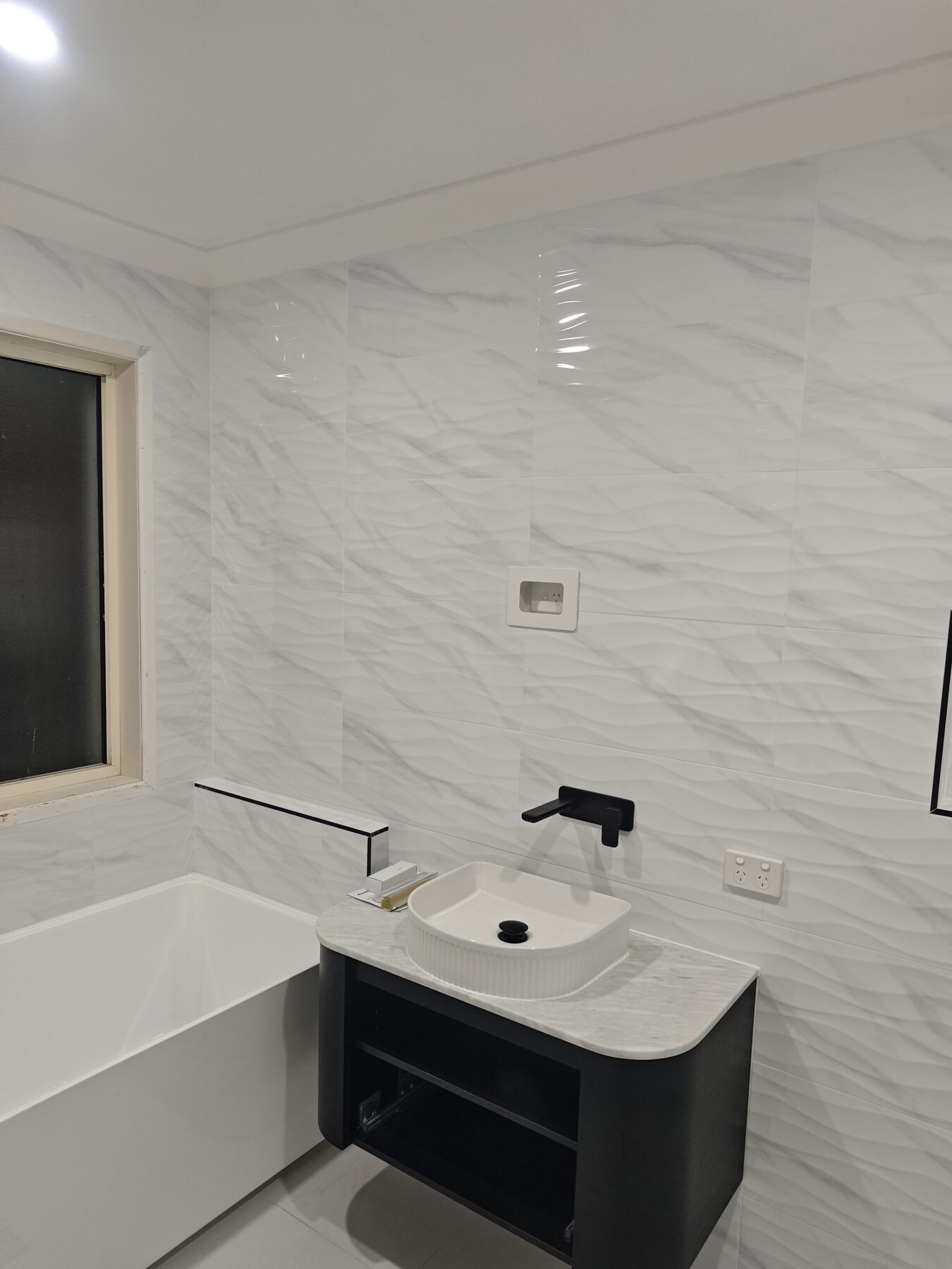 Completed bathroom renovation by Maxwell Plumbing and Electrical